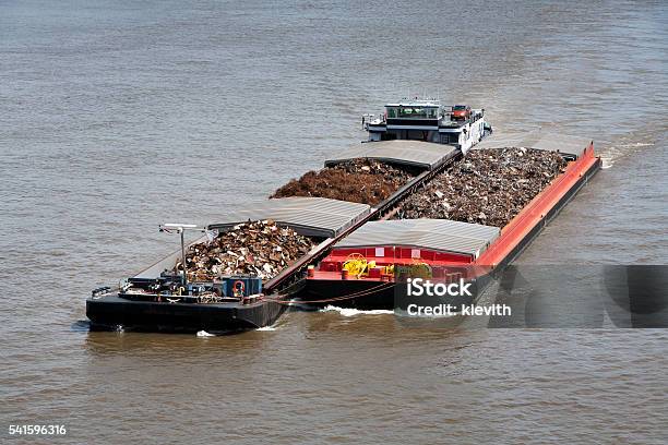 Two Barges Loaded With Metal Scrap Stock Photo - Download Image Now - Barge, Business, Business Finance and Industry