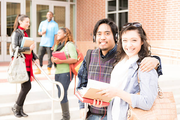 istock Education: Multi-ethnic group of college students talk on campus. 541596398