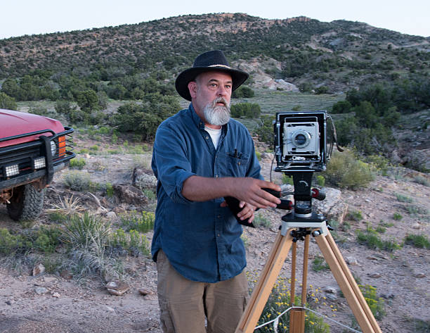 istock Mature Male Photographer with Medium Format Camera 541597100
