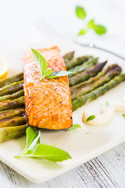 istock Salmon fillet baked with asparagus 541598610
