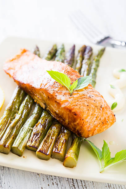 istock Salmon fillet baked with asparagus 541599160