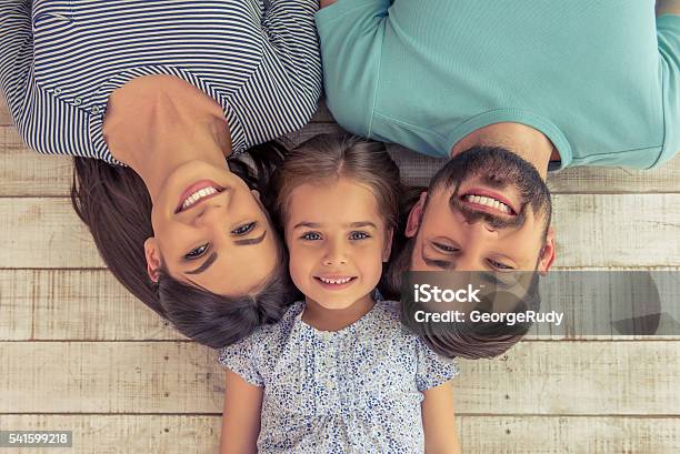 Happy Family Together Stock Photo - Download Image Now - Family with One Child, Family, Flooring