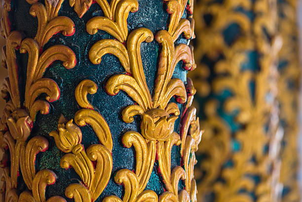 temple pole decorated with gold lotus floral pattern