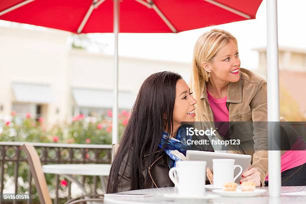 Friends At Outdoor Cafe Coffee Shop Digital Tablet Stock Photo - Download Image Now
