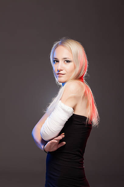 istock blond girl with a broken arm 541602686