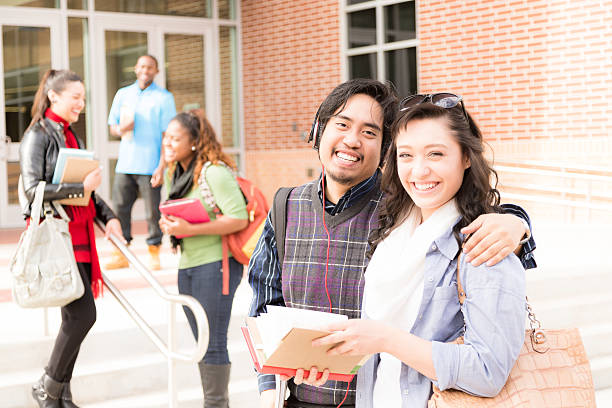 istock Education: Multi-ethnic group of college students talk on campus. 541602912