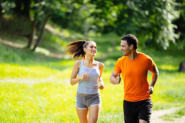 istock Healthy couple jogging in nature 541603822