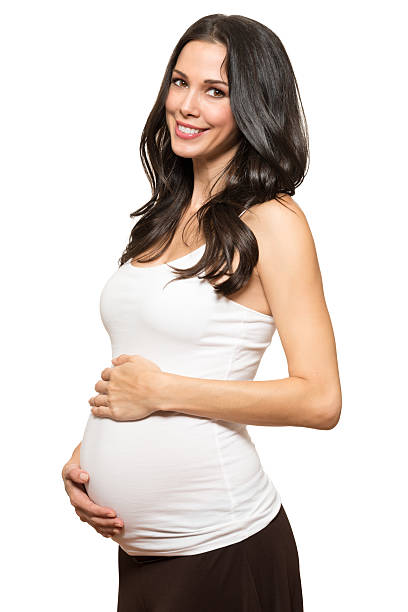istock Pregnant woman isolated on white background 541607676