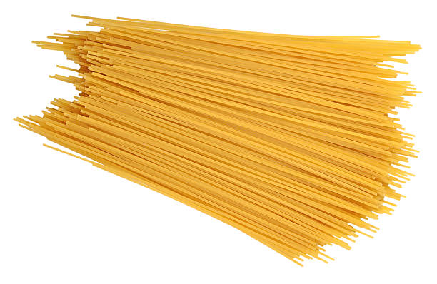 istock Uncooked Italian pasta spaghetti on a white 541607828