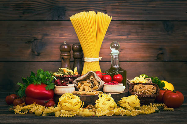 istock Variety of uncooked pasta and vegetables 541610140