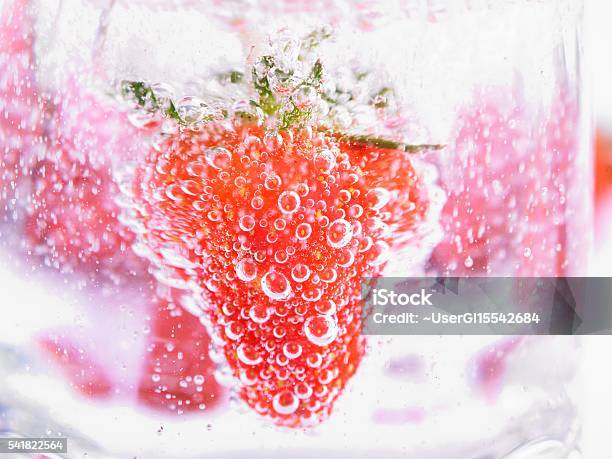 Strawberry In Mineral Water With Boobles Stock Photo - Download Image Now - Bobble Hat, Carbon Dioxide, Close-up