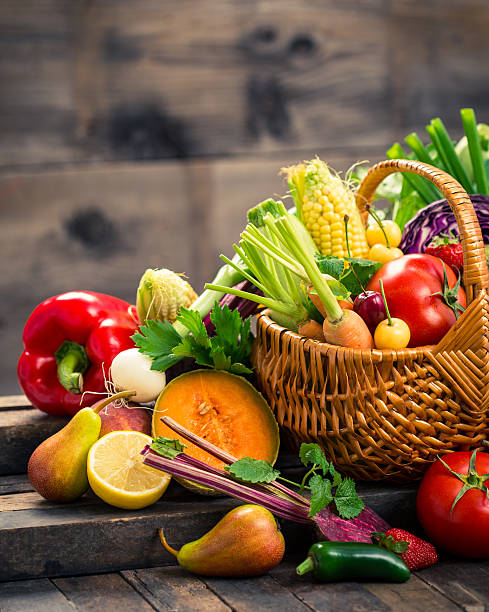 Fresh fruits and vegetables in the basket stock photo
