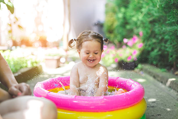 istock one year old baby playing in baby pool 541823852