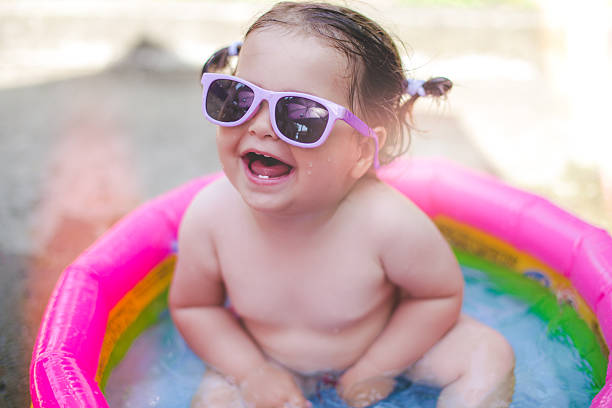 istock one year old baby playing in baby pool 541824508