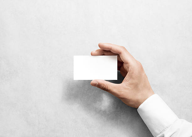 istock Hand holding blank white business card design mockup. 541824816