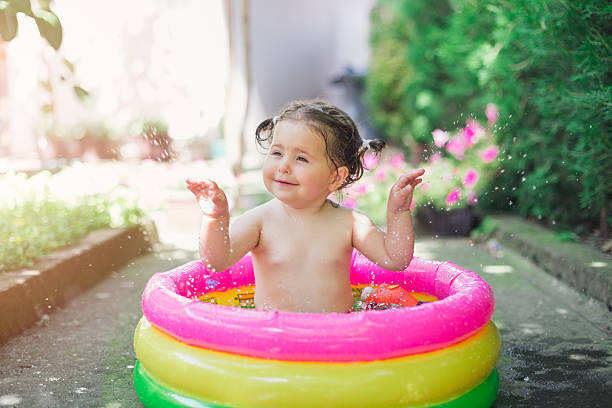 istock one year old baby playing in baby pool 541824860