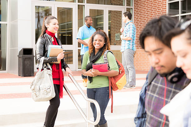 istock Education: Multi-ethnic group of college students talk on campus. 541829384