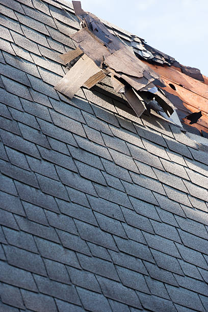 istock roof shingle damage from storm 541830340