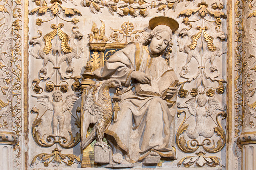 Avila, Spain - April 18, 2016: Avila - The relief of St. John the Evangelist in Girola of Catedral de Cristo Salvador.