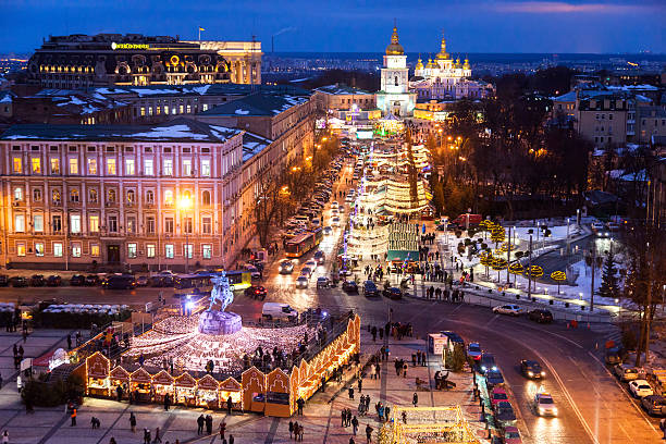 Kyiv, Ukraine - January 14, 2016: Christmas Fair is held at St. Sophia Square every year. Artist and performers show theirs performance, cafes are open till last visitors. Local and tourists willing to visit the Christmas Market.