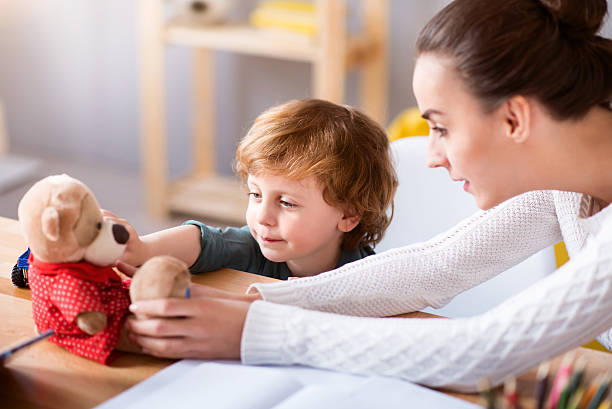 istock Woman and child sitting at the table 541831804