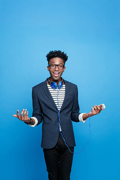 istock Happy afro american guy holding smart phone in hand 541833194