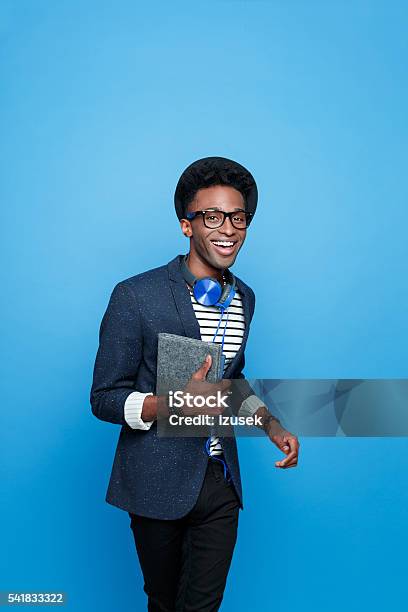 Excited Afro American Guy In Fashionable Outfit Holding Notebook Stock Photo - Download Image Now