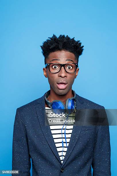 Surprised Afro American Guy In Fashionable Outfit Stock Photo - Download Image Now - Surprise, Rolling Eyes, Men