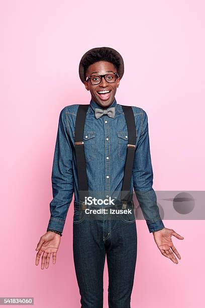 Excited Afro American Nerd Guy Stock Photo - Download Image Now - Men, Suspenders, Pink Background