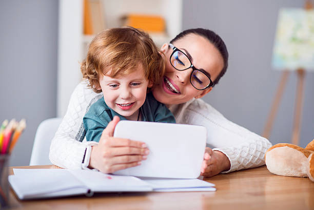 istock Mother and child looking at tablet 541834100