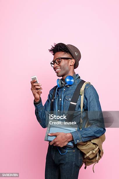 Afro American Student Using A Smart Phone Stock Photo - Download Image Now - Student, Mobile Phone, Men