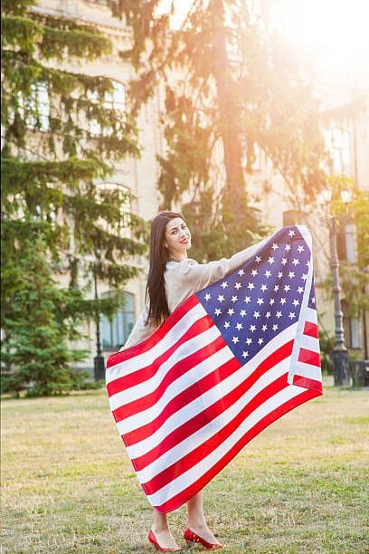 istock American flag and woman (4th july) 541834966