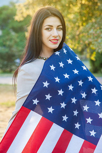istock American flag and woman (4th july) 541835046