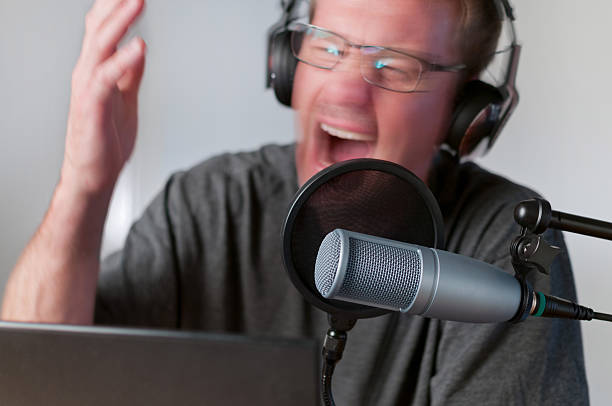 istock Angry Radio Host or Podcaster Working at His Desk 541835160