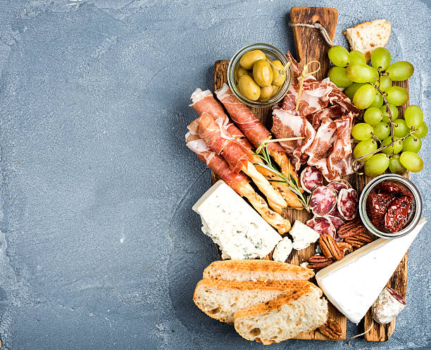 istock Cheese and meat appetizer selection. Prosciutto di Parma, salami, bread 541835866