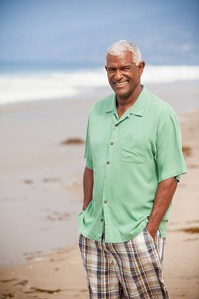 istock Senior African American Man Standing on Beach 541835896