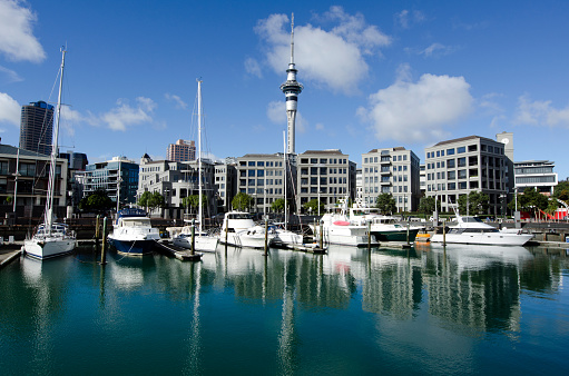 Auckland, New Zealand - May 26, 2013: Yachts mooring at Auckland Viaduct Harbor Basin on May 26 2013. It's a former commercial harbor turned into a development of upscale apartments, office space and restaurants.