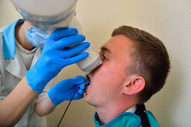 istock Dentist prepares to make tooth x-ray image for patient 541836840
