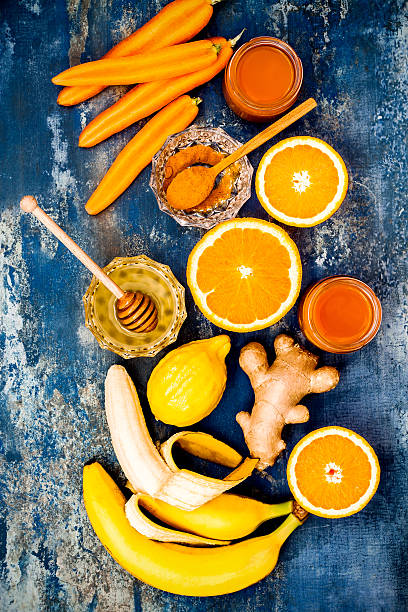 Detox carrot ginger turmeric immune boosting, anti inflammatory smoothie Carrot ginger immune boosting, anti inflammatory smoothie with turmeric and honey. Detox morning juice drink, clean eating anti inflammatory stock pictures, royalty-free photos & images