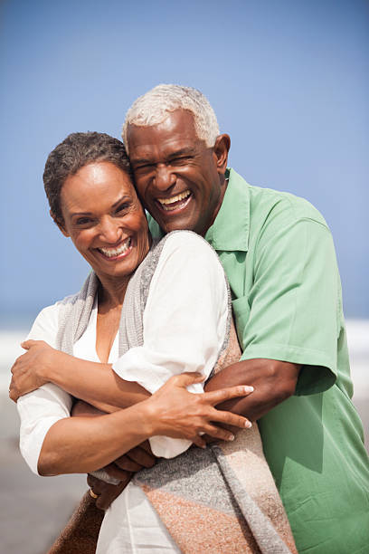 istock African American Seniors Smiling Together on Beach 541837498