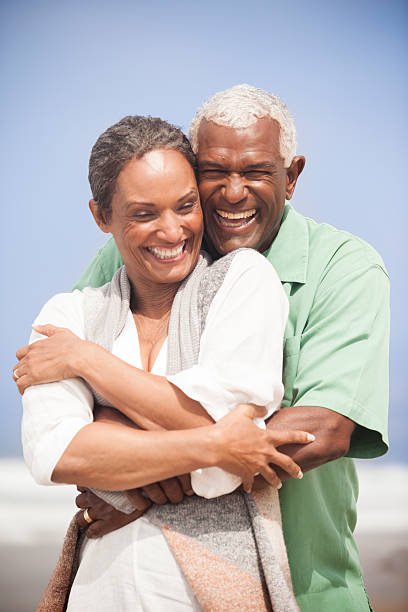 istock African American Seniors Smiling Together on Beach 541837532