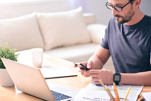 istock Man looking at screen of phone 541837788