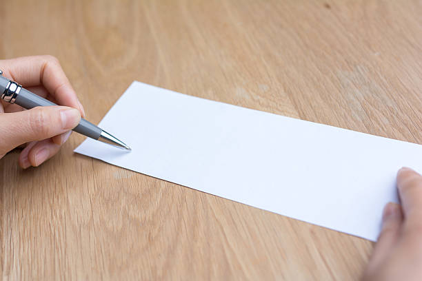 istock businesswoman writing on white paper 541841974