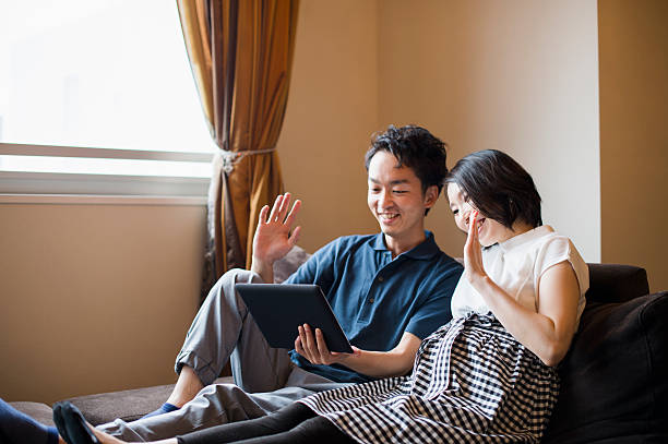 istock Mid-Adult couple watching digital tablet at home 541841982