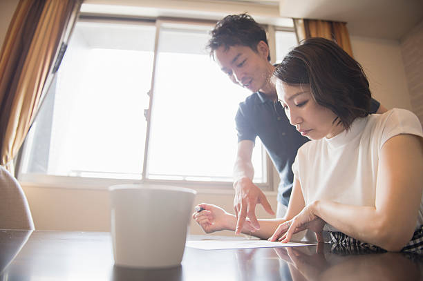 istock Mid adult woman writing documents 541842514