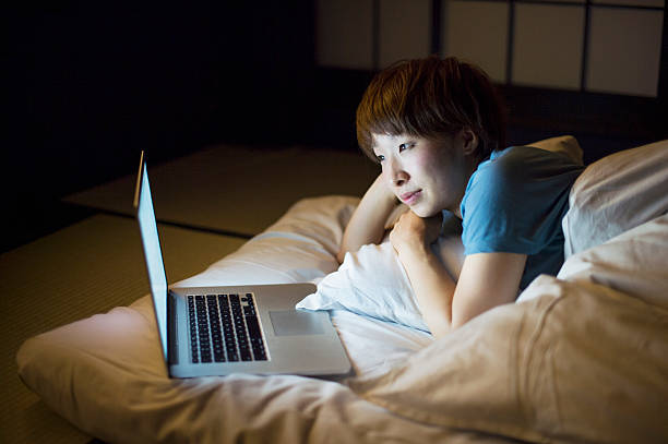 istock Woman using a laptop on the bed 541843914