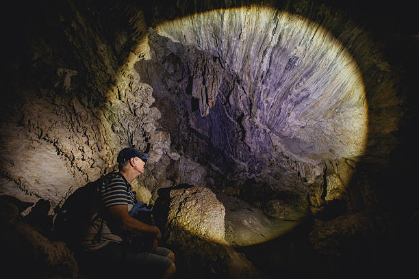 istock Man hiker in limestone cave. Packsaddle Cave. 541845644