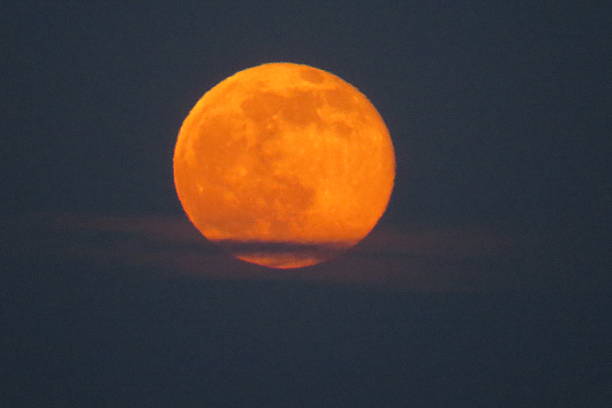 istock Strawberry Moon Rises Above the Clouds 541847620