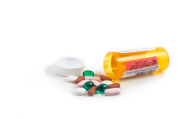 istock Prescription bottle with mixed pills. 541849884