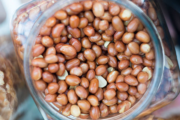 Common cooking peanuts in a jar .